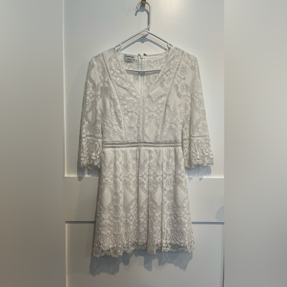 BeBe White Lace Dress
NWOT
Pet free smoke free home
Size 4